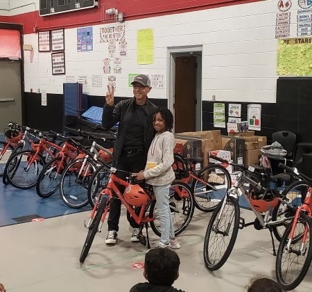 Marie Bike Recipient pictured with Ron